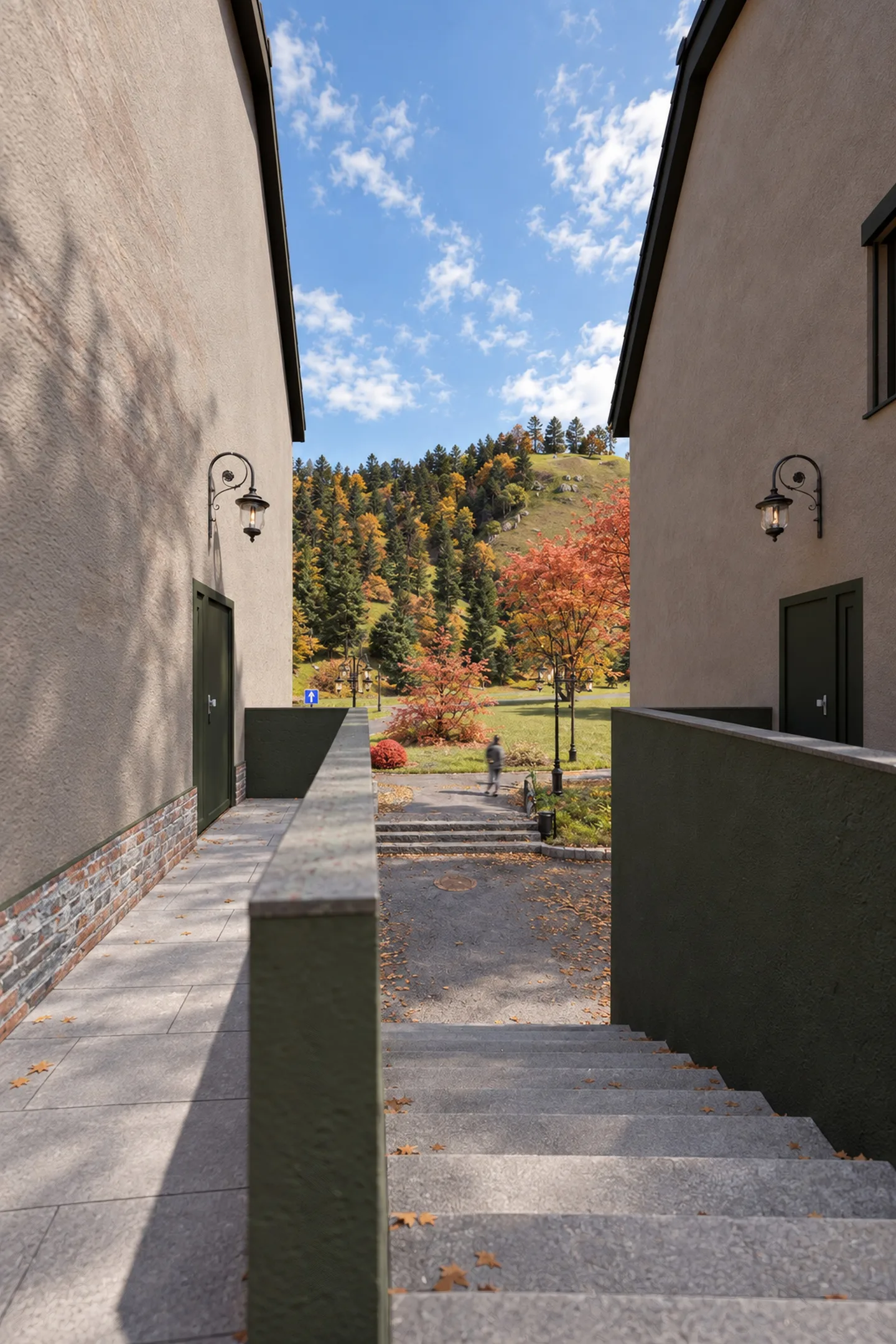 Treppenabgang zwischen zwei Gebäuden mit Blick auf die Berge